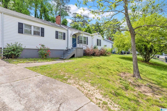 view of front of home with a front yard