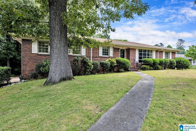 ranch-style house with a front lawn