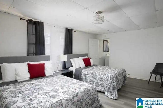 bedroom featuring wood-type flooring