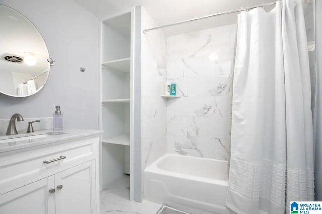 bathroom with shower / bath combo with shower curtain and vanity