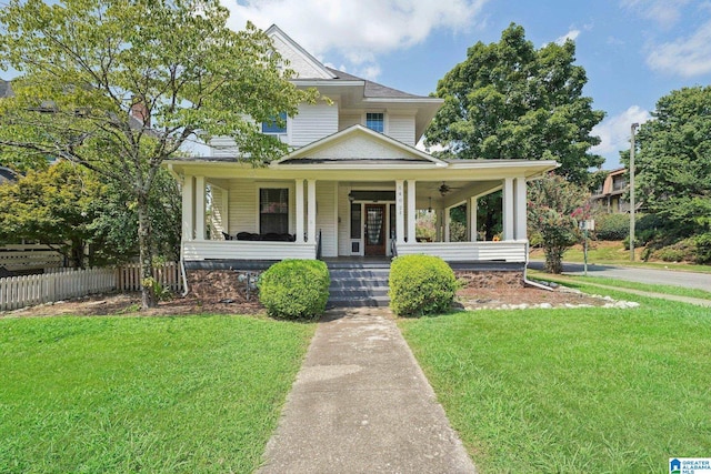 view of front facade with a front yard and a porch