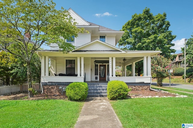 view of front of property featuring covered porch and a front lawn