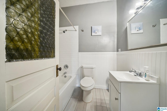 full bathroom with vanity, toilet, and washtub / shower combination