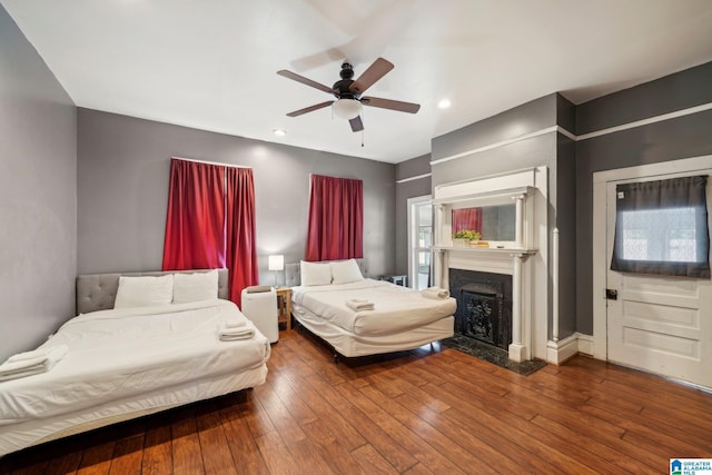 bedroom with hardwood / wood-style floors and ceiling fan