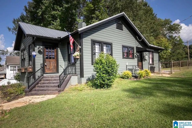 bungalow with a front yard