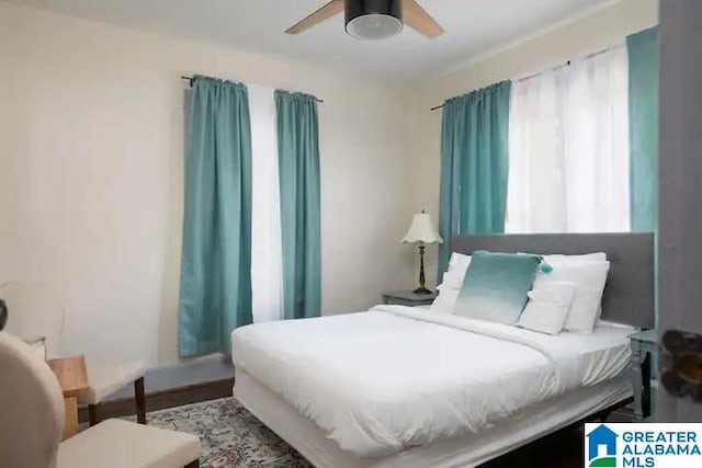 bedroom featuring hardwood / wood-style floors and ceiling fan