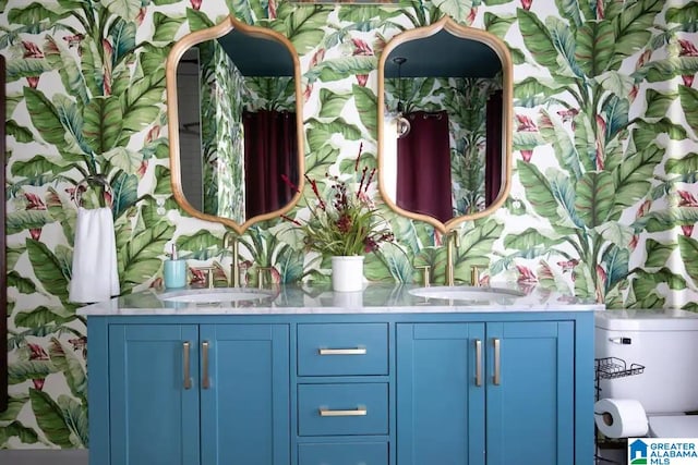 bathroom featuring vanity and toilet