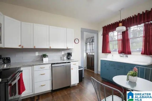 kitchen featuring white cabinetry, stainless steel appliances, dark hardwood / wood-style flooring, decorative light fixtures, and decorative backsplash