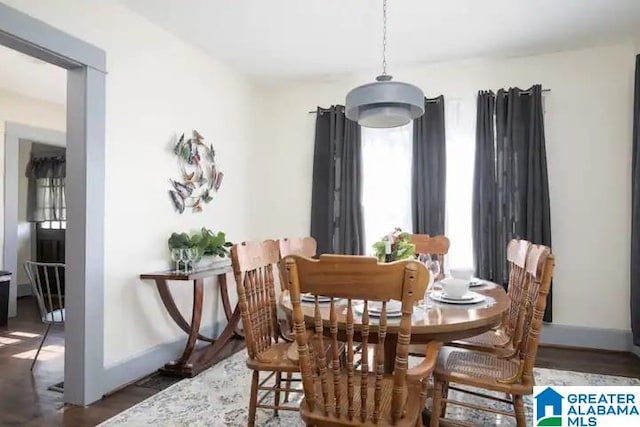 dining area featuring dark hardwood / wood-style flooring