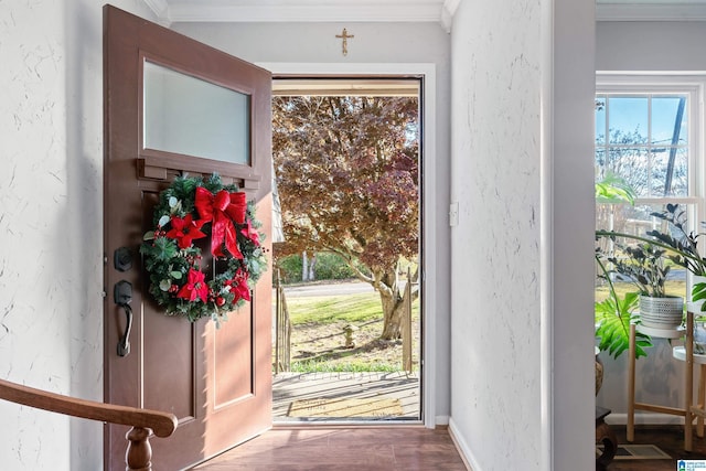 doorway with wood-type flooring and crown molding