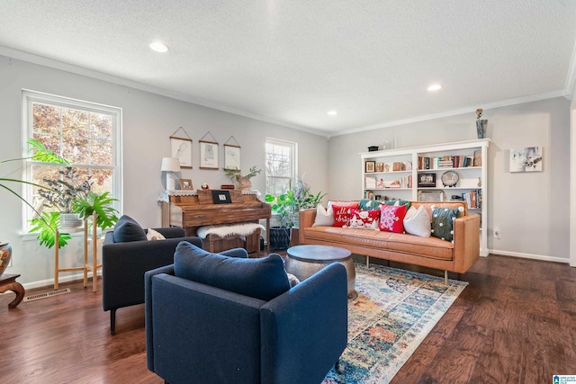 living room with a textured ceiling, crown molding, and dark hardwood / wood-style floors