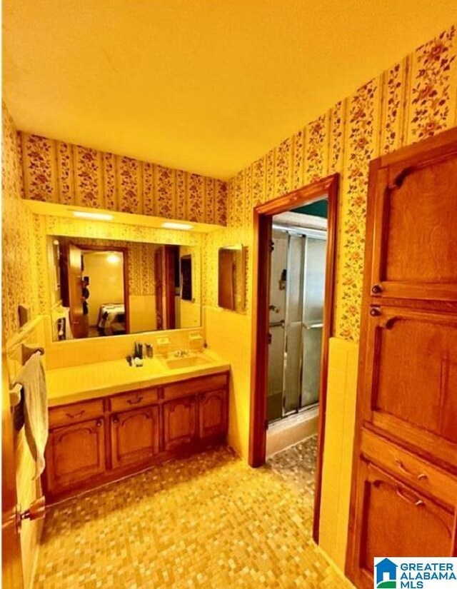 bathroom with vanity and walk in shower