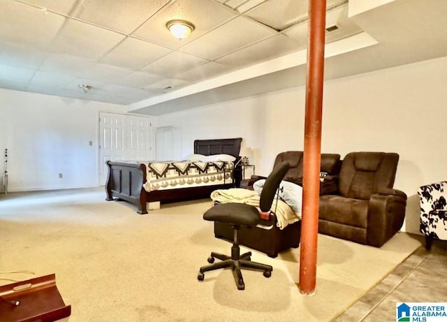 carpeted bedroom with a paneled ceiling