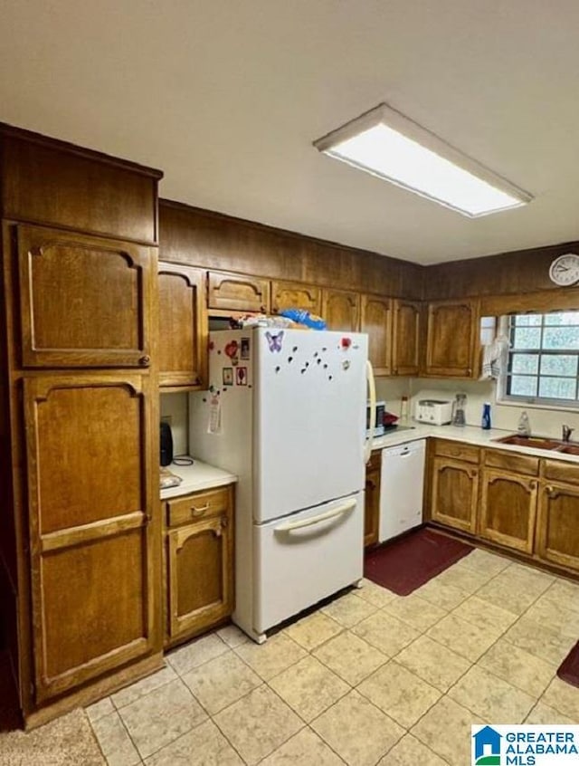 kitchen with white appliances and sink