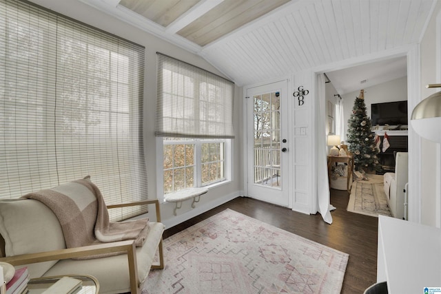 sunroom / solarium featuring wooden ceiling and lofted ceiling