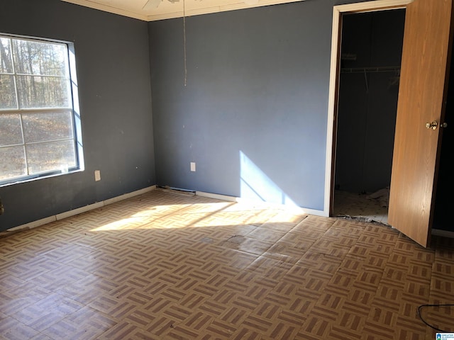 spare room with dark parquet flooring