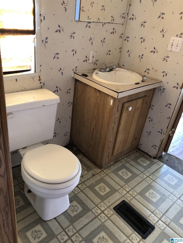 bathroom with vanity and toilet