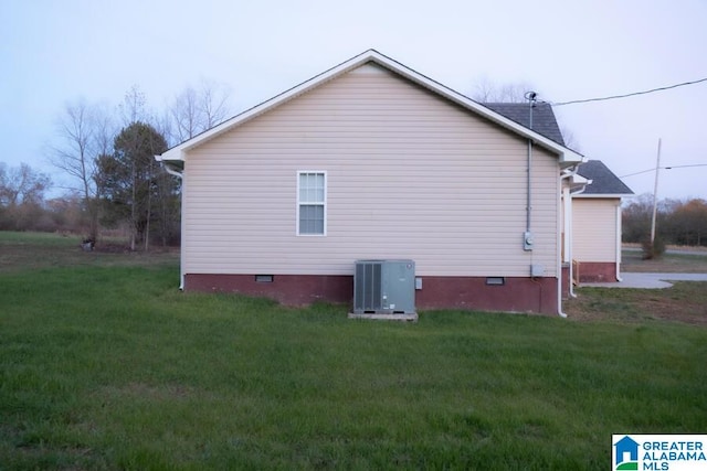 view of home's exterior featuring a yard and central air condition unit