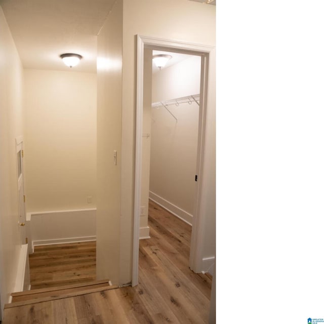 corridor featuring light hardwood / wood-style floors