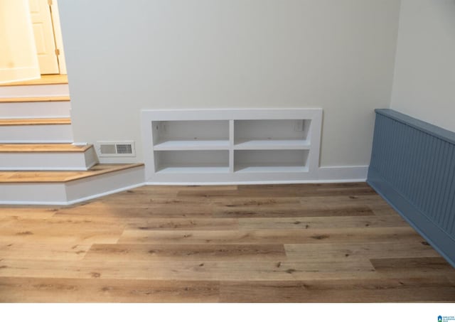 staircase featuring hardwood / wood-style floors