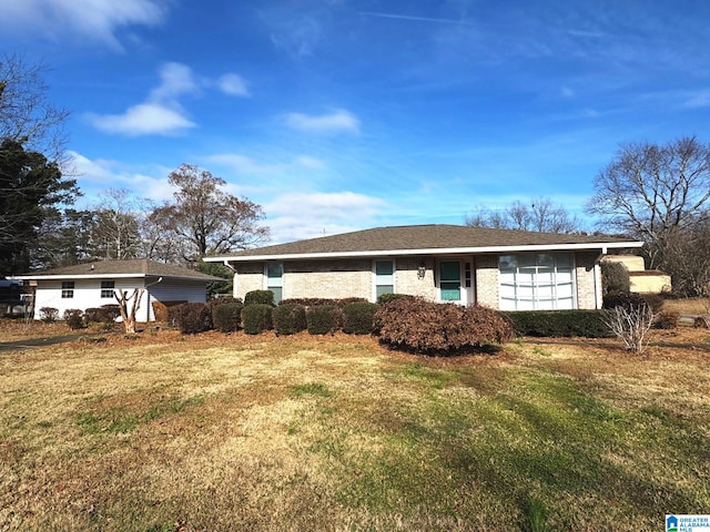 ranch-style home with a front lawn