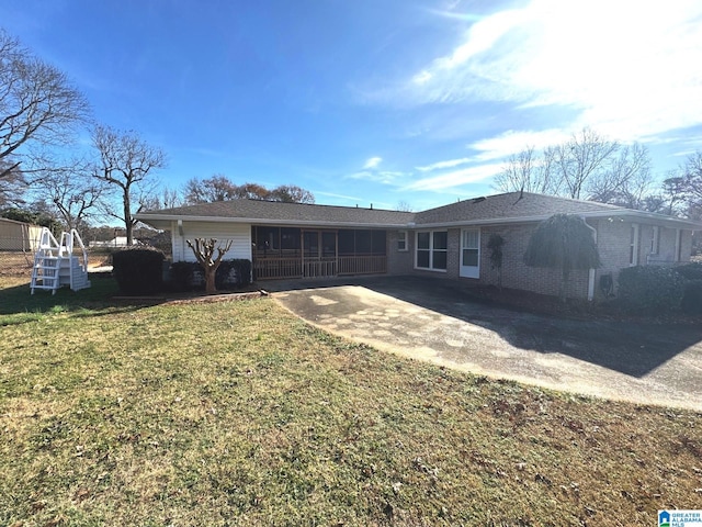 rear view of property with a yard