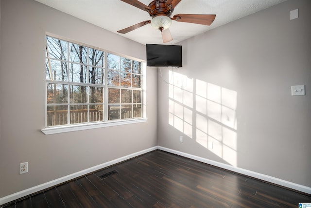 spare room featuring ceiling fan, a textured ceiling, and hardwood / wood-style flooring