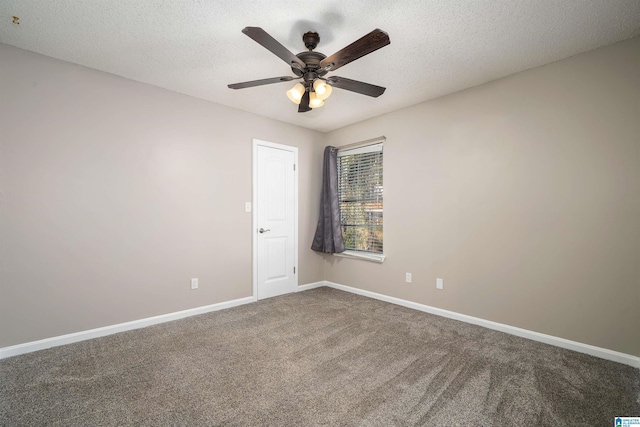 empty room with carpet, a textured ceiling, and ceiling fan