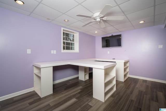 unfurnished office featuring dark hardwood / wood-style flooring and a paneled ceiling