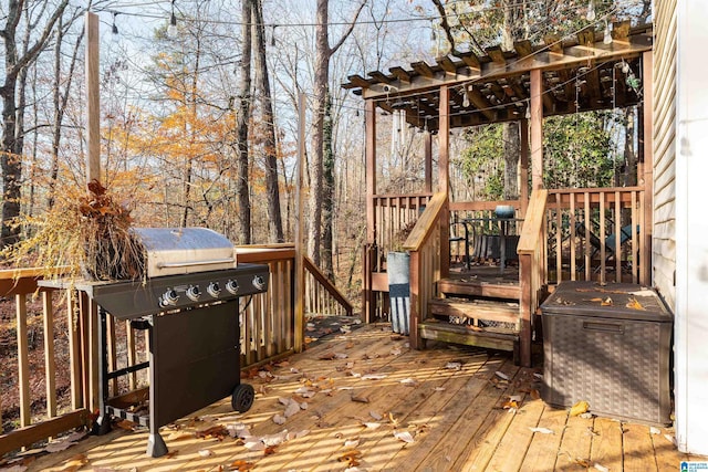 wooden deck with a grill