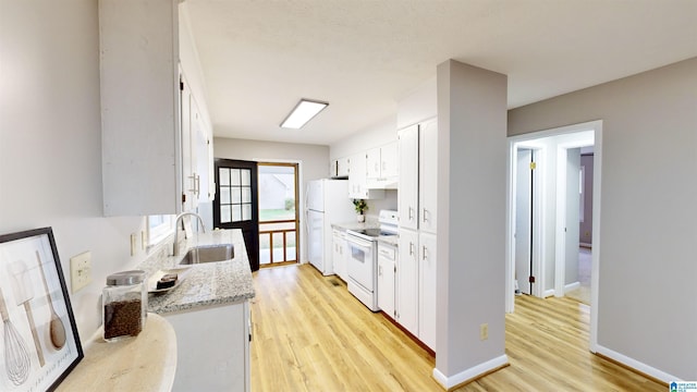 kitchen featuring white cabinets, light wood-type flooring, white appliances, and sink