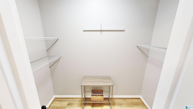 spacious closet featuring hardwood / wood-style floors