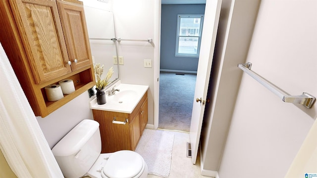 bathroom with vanity and toilet