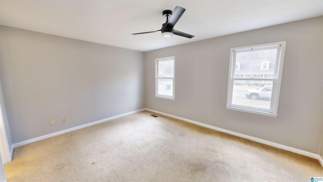 carpeted empty room with ceiling fan