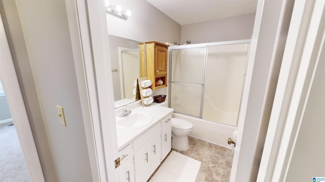 full bathroom with toilet, vanity, and combined bath / shower with glass door