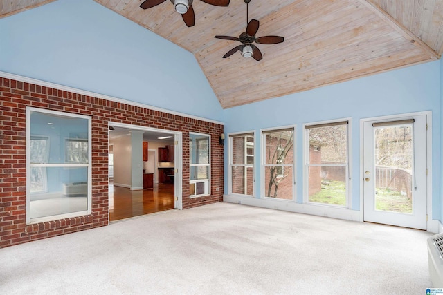 unfurnished sunroom with vaulted ceiling, ceiling fan, and wood ceiling