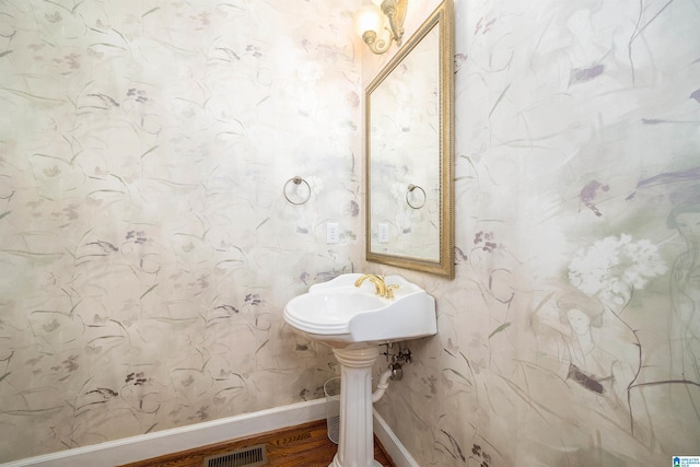 bathroom featuring hardwood / wood-style flooring and sink