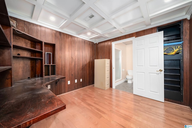 office area with beam ceiling, wood walls, light hardwood / wood-style floors, and coffered ceiling