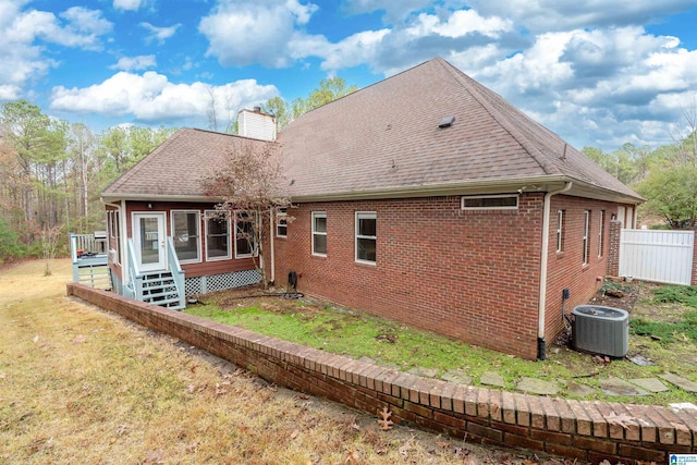 back of house featuring central AC unit