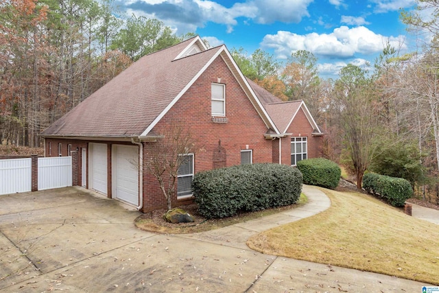 view of side of property with a garage