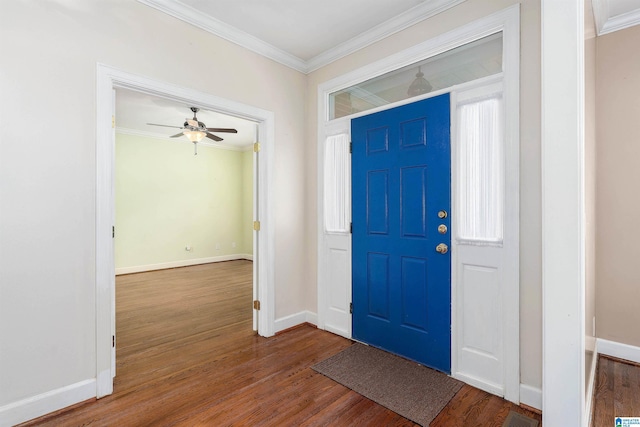 foyer featuring dark hardwood / wood-style floors, ceiling fan, and ornamental molding