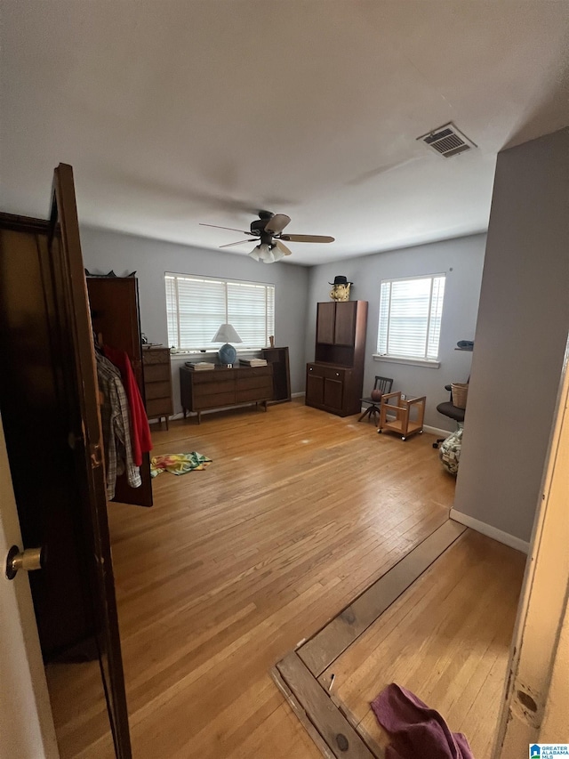 bedroom featuring ceiling fan and light hardwood / wood-style flooring