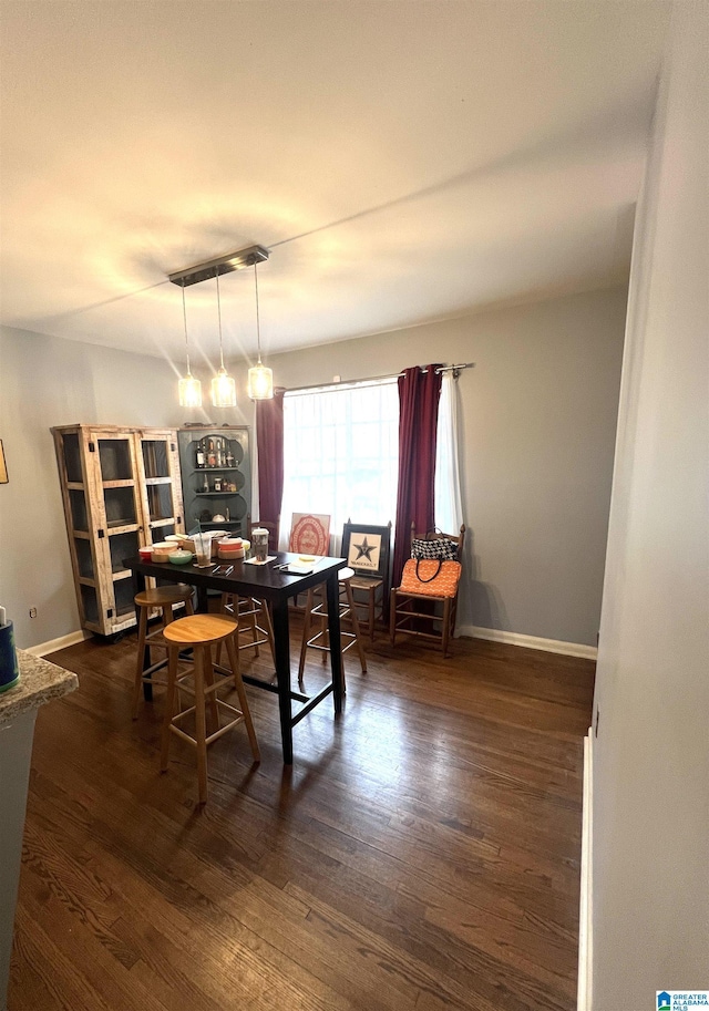 dining room with dark hardwood / wood-style floors