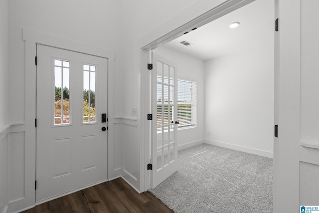 doorway to outside featuring dark hardwood / wood-style floors and a healthy amount of sunlight