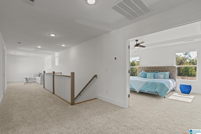 hallway with light colored carpet