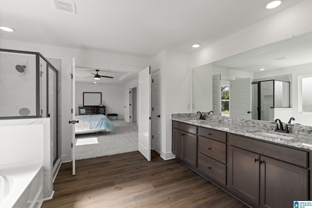 150 Sage Dr, Pell City, AL 35128 - full bath featuring a shower stall, ceiling fan, double vanity, wood finished floors, and recessed lighting