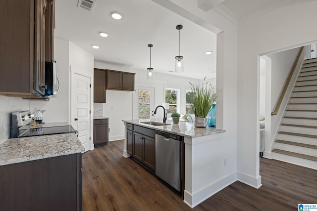 150 Sage Dr, Pell City, AL 35128 - kitchen featuring appliances with stainless steel finishes, dark brown cabinetry, dark wood-type flooring, light stone countertops, and recessed lighting