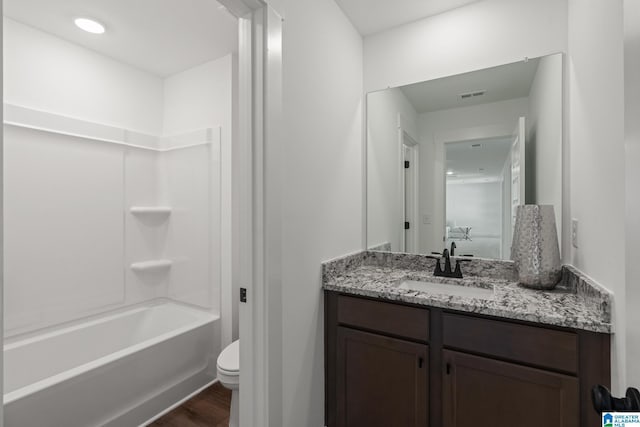 150 Sage Dr, Pell City, AL 35128 - full bathroom featuring vanity, wood finished floors, and shower / tub combination