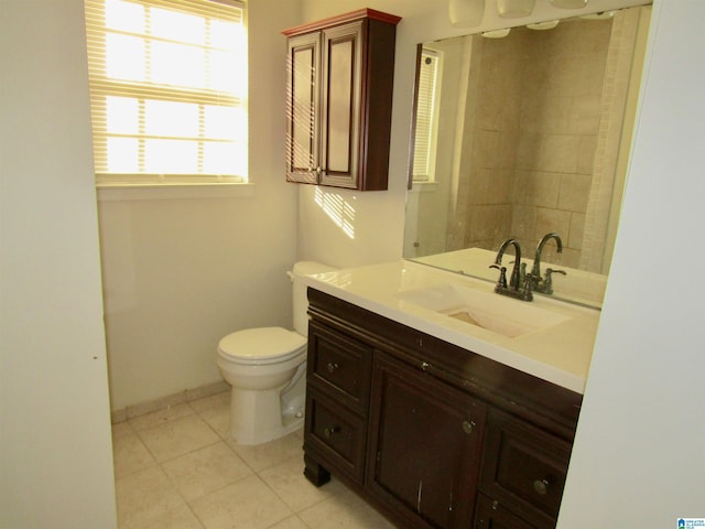 bathroom with tile patterned floors, vanity, and toilet