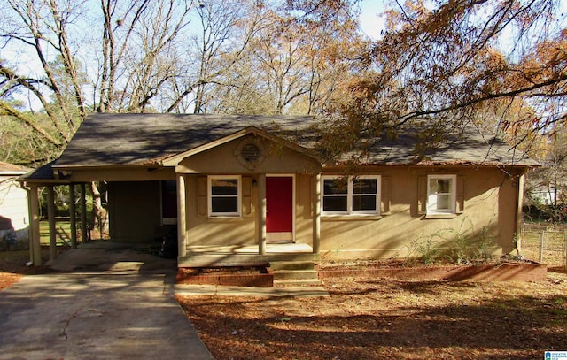 ranch-style house featuring a carport